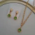 Conjunto ponto de luz verde banhado a ouro 18k - comprar online