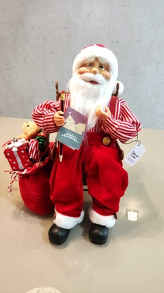 Papai Noel de 40cm sentado na cadeira de balanço movimento e som - 51837001 na internet