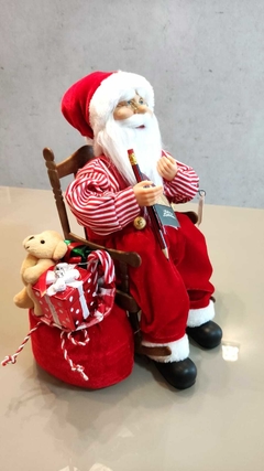 Papai Noel de 40cm sentado na cadeira de balanço movimento e som - 51837001 - comprar online