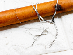 conjunto cadena plana moño + prolongador acero quirurgico - comprar online