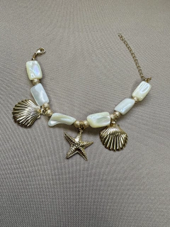 Pulseira Madrepérola com Pingente Concha e Estrela Dourado/Prata na internet