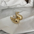 BRINCO GOTA CURVA TEXTURIZADA DOURADO - comprar online