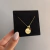 COLAR PERSONALIZADO MEDALHA 15 mm E MINI PINGENTE DE CORAÇÃO DOURADO - comprar online