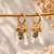 Brinco Trio da Prosperidade Dourado - comprar online