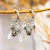Brinco Trio da Prosperidade Prata - comprar online
