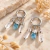 Brinco Trio 2026 | Quartzo de Cristal e Água Marinha Prata