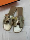 Rasteira Flat Hermes Dourada Italiana