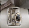 Relógio Bulgari Serpenti Dourado e Prata com Fundo Preto e Brilho Duas Voltas taliana
