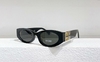 Óculos de Sol Miu Miu Eyewear Preto com Dourado Italiana