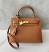 Bolsa Hermes Kelly 25 Epsom Caramelo e Dourada Italiana
