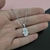 Colar com pingente mão de fatima olho grego em resina e aço inoxidável hamsa 50cm - comprar online