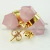 Brinco Micro Bi Ponta Pedra Quartzo Rosa Envolto Dourado - comprar online