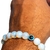 Pulseira Bolinha Pedra da Lua Opalina Com Olho Grego 10mm Fio Silicone Elastico na internet