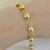 COD6302 PULSEIRA BOLINHAS DOURADA