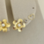 COD8093 TRIO DE BRINCOS FLOWERS DOURADO - comprar online