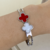 COD8517 BRACELETE DUO TREVO WHITE AND RED AÇO NIQUÉL
