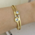 COD8571 BRACELETE INSPIRAÇÃO BV AÇO DOURADO