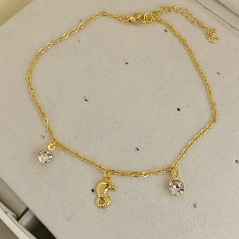 COD7156 TORNOZELEIRA CAVALO MARINHO PONTO DE LUZ DOURADO