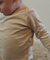 Body infantil canelado bege claro de manga longa.
