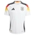 Camisa branca da Seleção da Alemanha para torcedores, modelo masculino, com detalhes em vermelho e preto e logo da Adidas.
