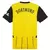Camisa amarela e preta do Borussia Dortmund, com o nome "DORTMUND" na parte de trás e detalhes em preto nas mangas.