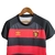 Camisa do Kit Infantil Sport I da Umbro, modelo 23/24, nas cores vermelho e preto, com estampa listrada e logo da marca.