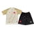 Kit infantil de futebol Vasco da Gama III, composto por camisa bege e shorts pretos, com detalhes em vermelho e dourado.