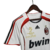 Camisa retrô branca do Milan 2006/2007, com detalhes em vermelho e logotipo da Adidas.