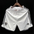 Shorts brancos do Atlético Mineiro, modelo away 23/24, com detalhes em preto e logo do clube.