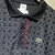 POLO LACOSTE MEIA QUADRI PRETA na internet