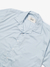 Camisa boxy azul claro com colarinho e botões frontais, da marca KMZ.