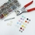Set 100 Broches Doble Aro 9.5 Colores + Pinza y Colocador de Golpe
