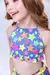 Biquíni cropped para crianças com estampa colorida de estrelas em tons neon.