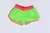 Short de praia verde neon com detalhes em rosa, ideal para meninas.