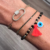 Pulsera Ojito con Fleco Plateada - Yellow Store