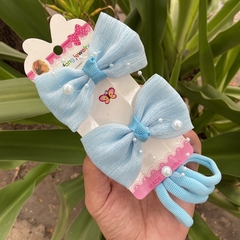 Set niña (dos moños picos con perlas y cuatro colitas) en internet