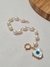 Pulseira de pérolas naturais com pingente de olho grego em madrepérola cravejado com zircônias coloridas - comprar online
