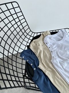 musculosa tachas