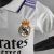 camisa-infantil-real-madrid-2022-22-23-vini-jr-branca-polo-roxo-champions-rodrygo-home-1-i-titular-