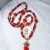 Guia de Pomba Gira Rainha com Coroa e Tridente | Fio de Contas Vermelho e Dourado Artesanal na internet