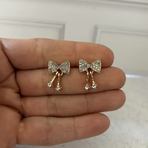 Aros moño de acero dorado con strass - comprar online