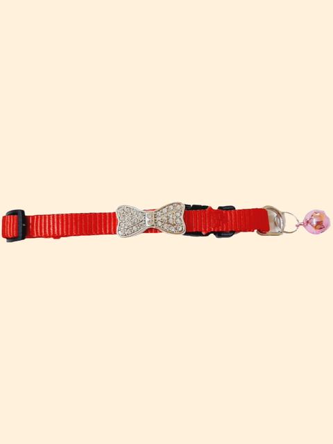 COLLAR MOÑO CON STRASS Y CASCABEL