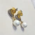 Conjunto colar e brinco pérola e zircônias banhado em ouro na internet