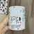 Caneca de Cerâmica Flork Música Espumas ao Vento "De uma coisa fique certa, amor" - comprar online
