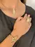 BRACELETE FOLHA ONDULADA BANHADO A OURO 18K/BOX76" - comprar online