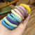 Pack de 50 Anillos para el Pelo de Niña en Caja con Degradado de Colores Caramelo - comprar en línea