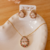 CONJUNTO EM FORMATO DE GOTA CRISTAL COM CONTORNO EM MICROZIRCONIA COLORIDA - comprar online