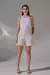 Short off-white feminino em linho com cintura alta e botões forrados — visual clean e sofisticado.