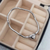 Pulseira berloque aço inox Dora com fecho de coração