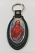 Llavero simil cuero oval con imagen del Sagrado Corazón